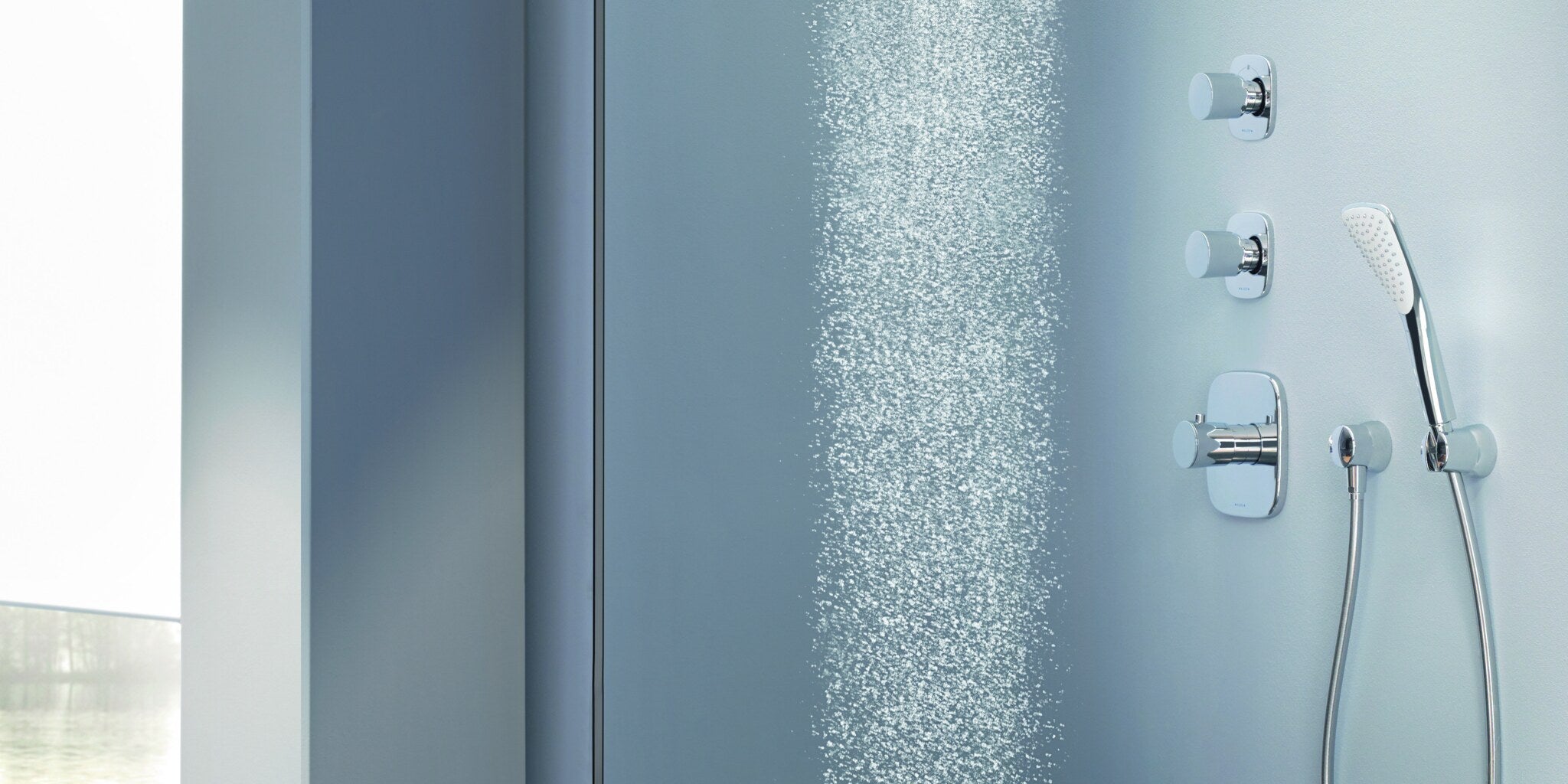 Concealed shower system with a rain shower and a hand shower running