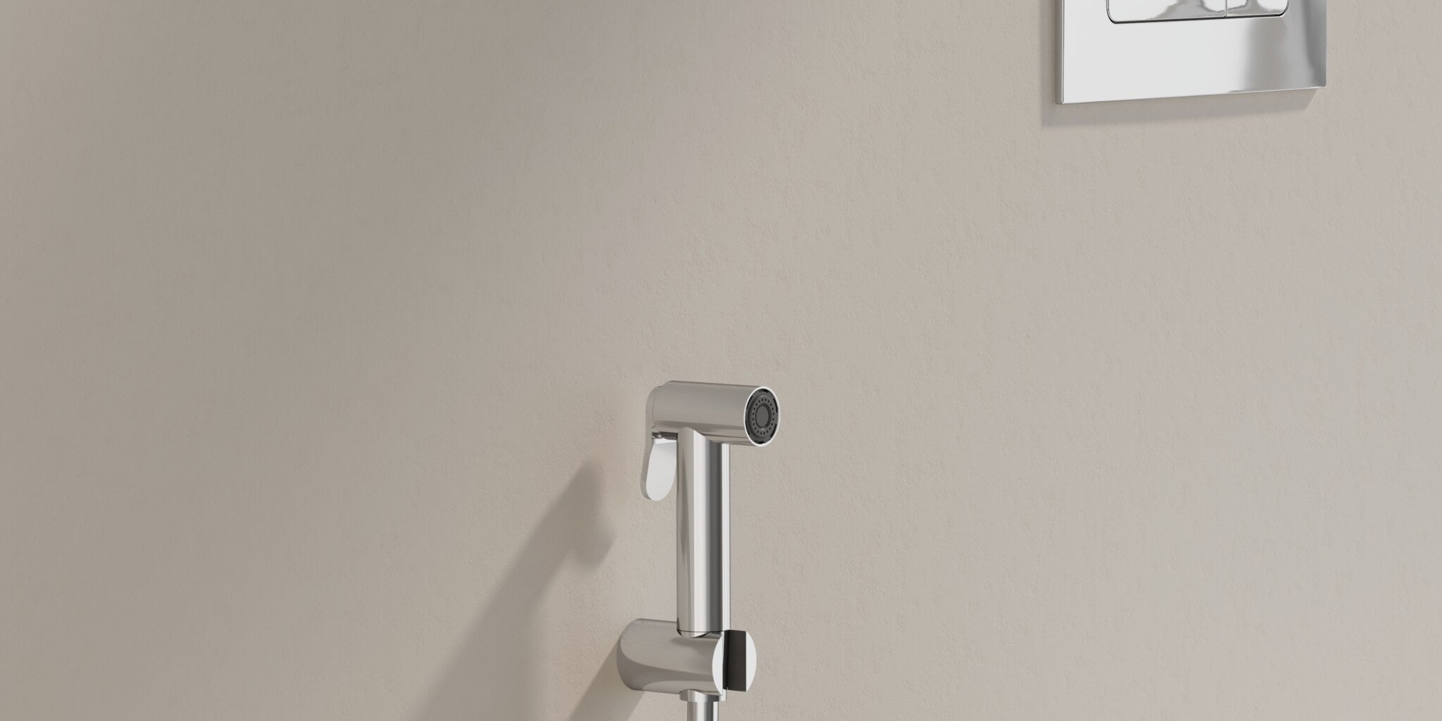 Shattaf on its wall holder beside a wall-hung WC