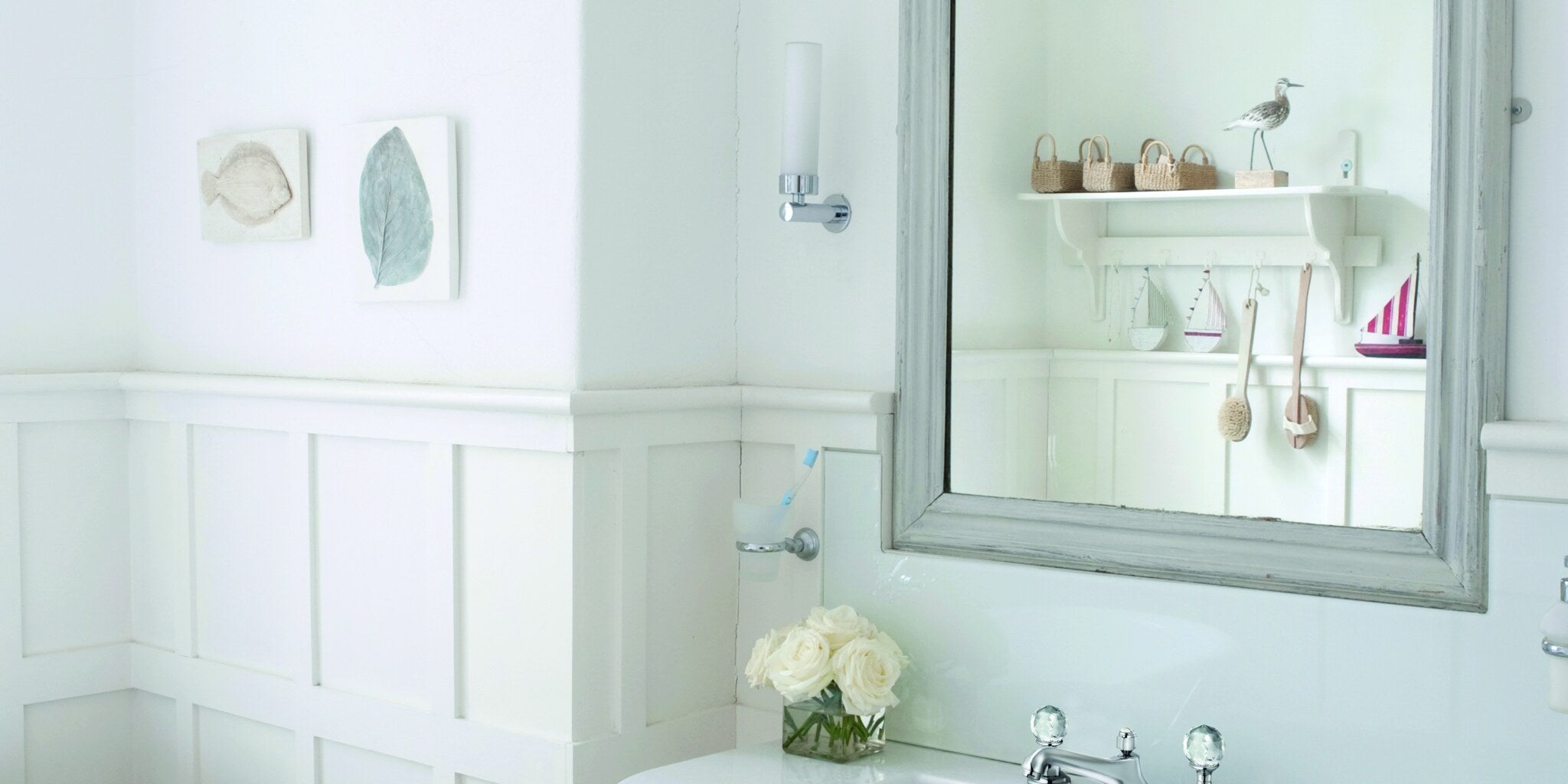 Classic panelled bathroom with a framed mirror over a washstand