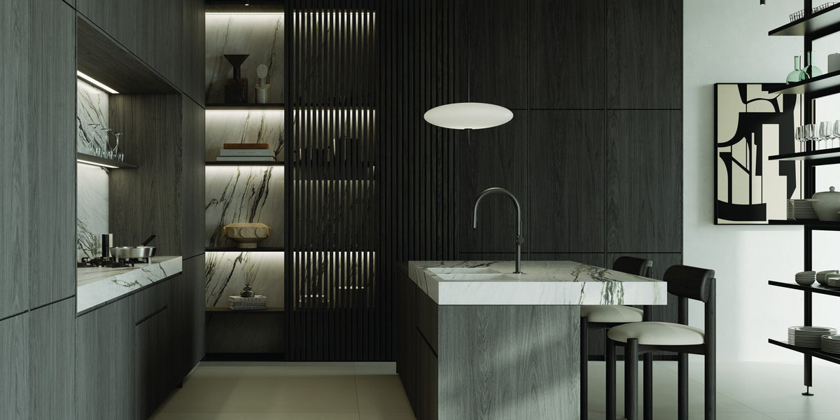 Dark kitchen with a marble island and a KLUDI-REEF mixer
